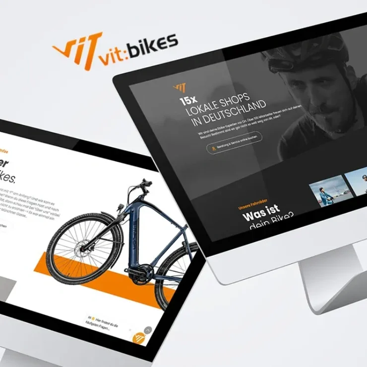 Ein Computermonitor und ein Tablet, die die Webseite von vit.bikes mit Informationen über ihre Fahrräder und Dienstleistungen präsentieren.